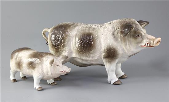 Two Continental porcelain models of standing boars, 35.5cm and 21.5cm long